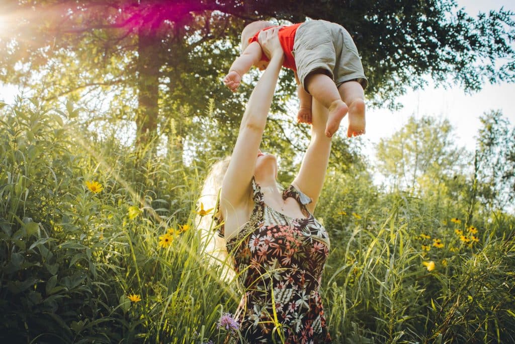 Mother Lifting Her Baby. Children's Naturopath. Brisbane Livewell Clinic.