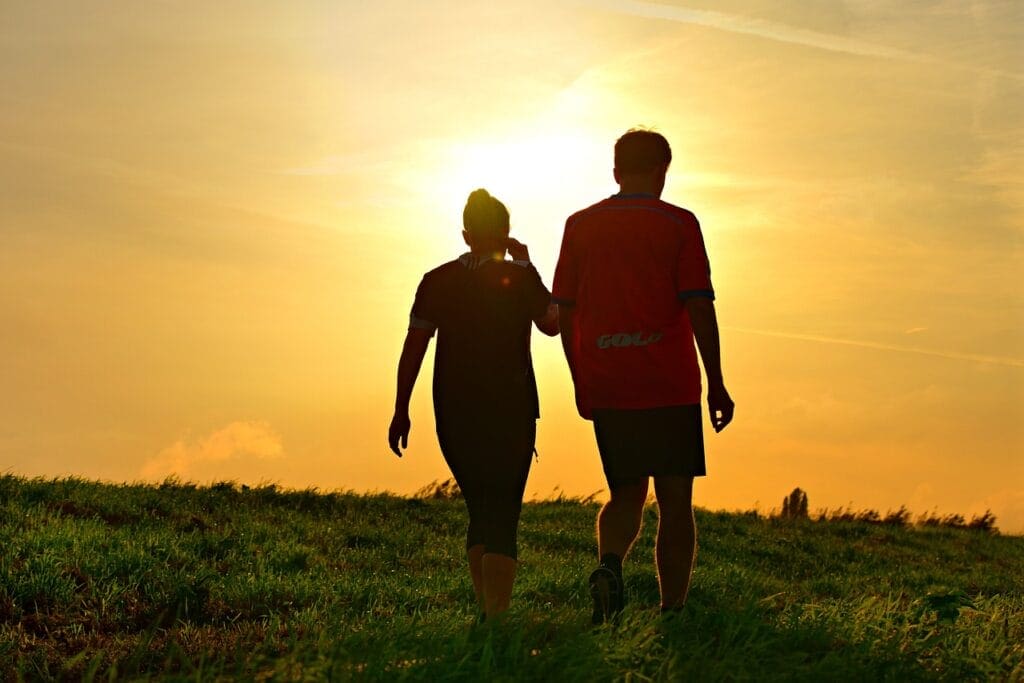 Man and Woman walking through the sunset. Treating Vaginal Thrush. Recovery after Viral Infection. Brisbane Livewell Clinic