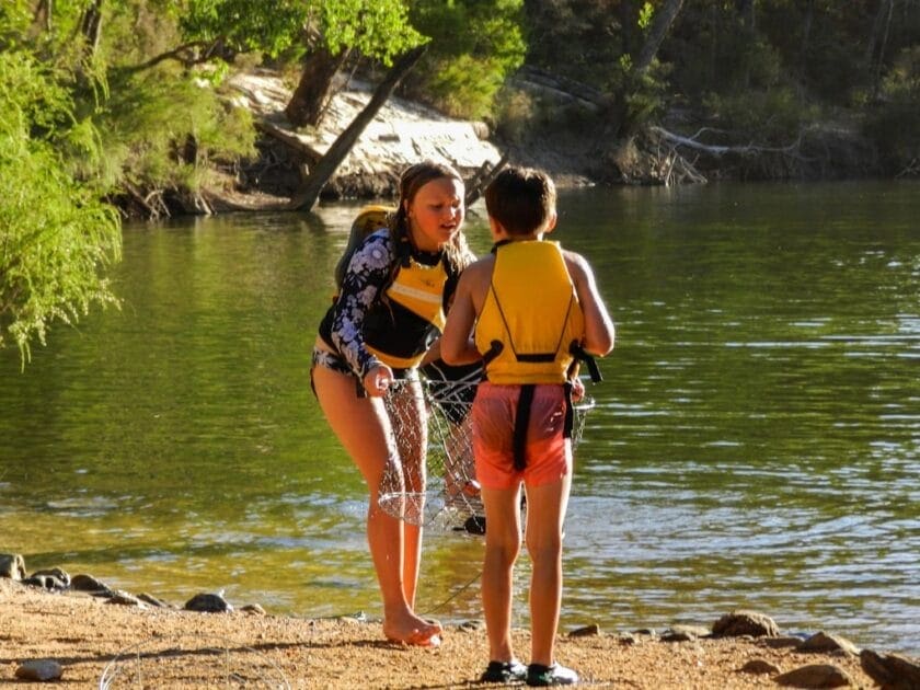 Two teenagers standing on shore during daytime. DNA Testing Brisbane