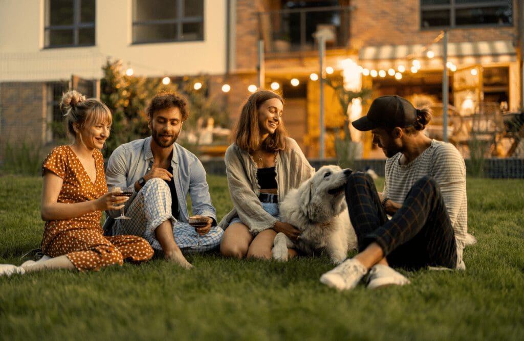 Friends having fun drinking wine and playing with a dog. Dealing with Depression. Bridgeman Downs. Gastric Band Hypnosis. Brisbane Livewell Clinic