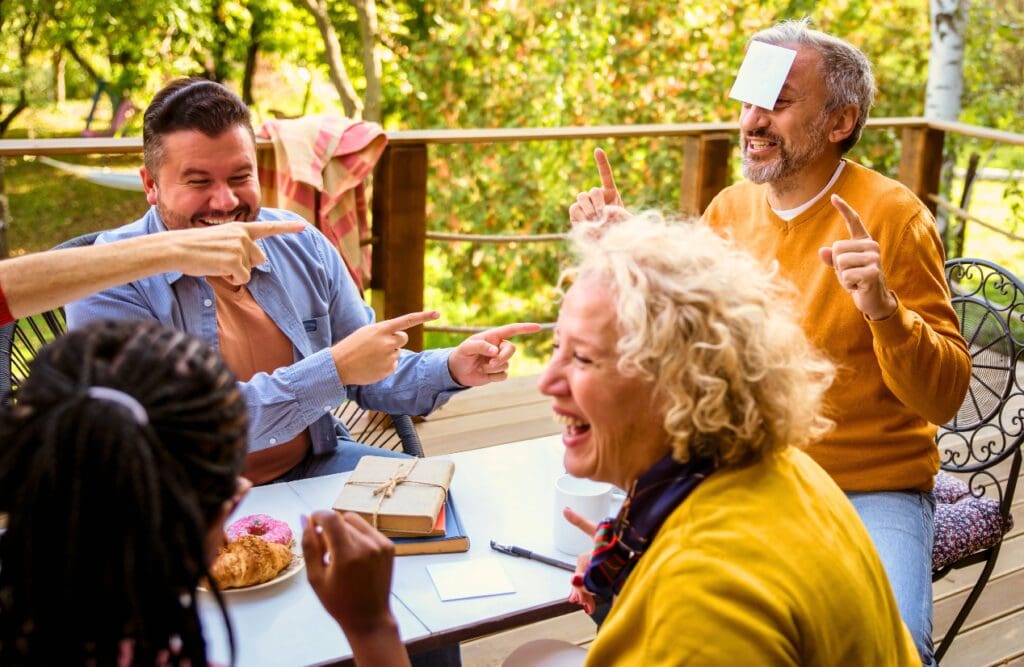 A group of adult people playing guessing game. Sress. Naturopath. Brisbane Livewell Clinic