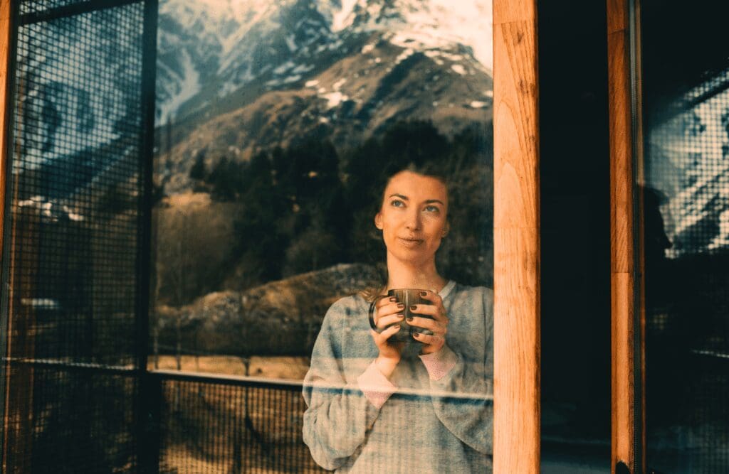 Woman enjoying her tea while looking at the mountains. Food Allergy Testing Near Me. Brisbane Livewell Clinic