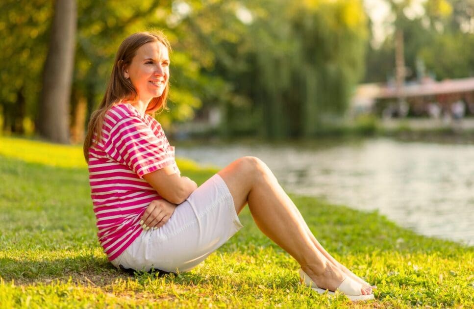 Woman sitting on the grass in a park. At Home Hormone Test. Perimenopause. Clinical Hypnosis for Menopause. Brisbane Livewell Clinic