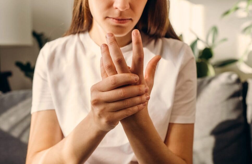Woman holding and pressing her fingers together. Nutrition Deficiency. Brisbane Livewell Clinic