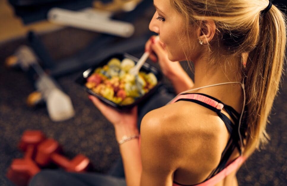Woman eating healthy food in the gym. Weight Gain Challenges. Nutrition. Clinical Nutritionist Carindale. Brisbane Livewell Clinic