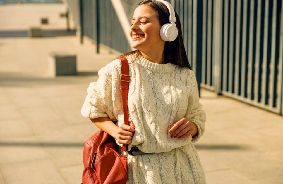 Happy woman walking along the road. Spring Detox. What is Lymphatic Drainage Massage. Hypnosis for Weight Loss. Acupuncture for Migraines. Brisbane Livewell Clinic