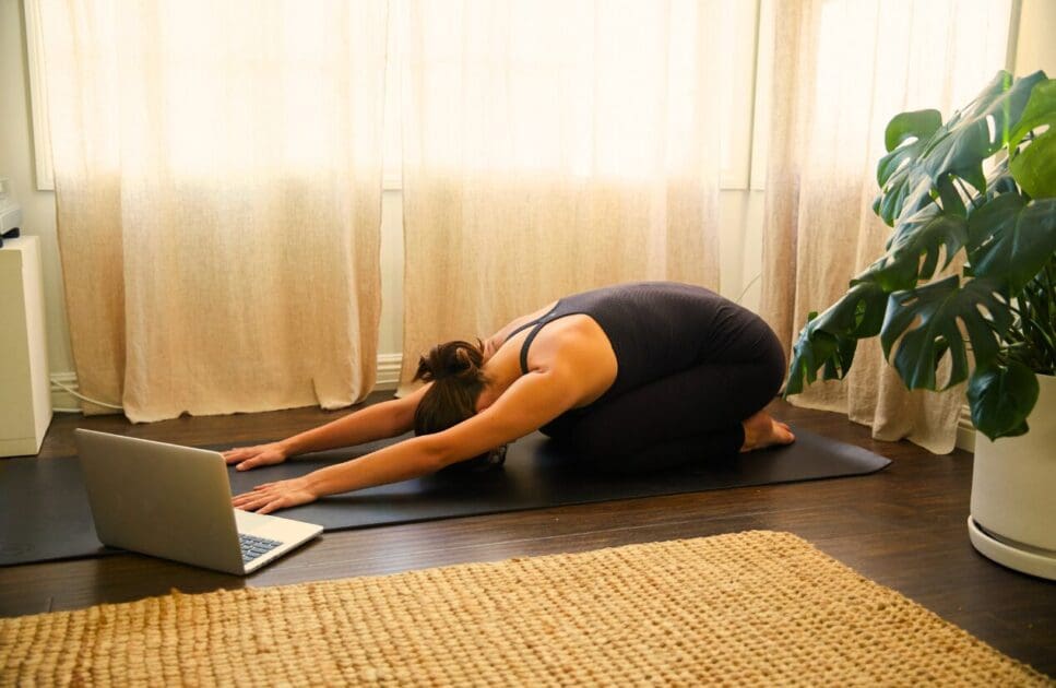 Woman practicing yoga at home. Mothers Day. Detoxing. Osteopath Coorparoo. Brisbane Livewell Clinic