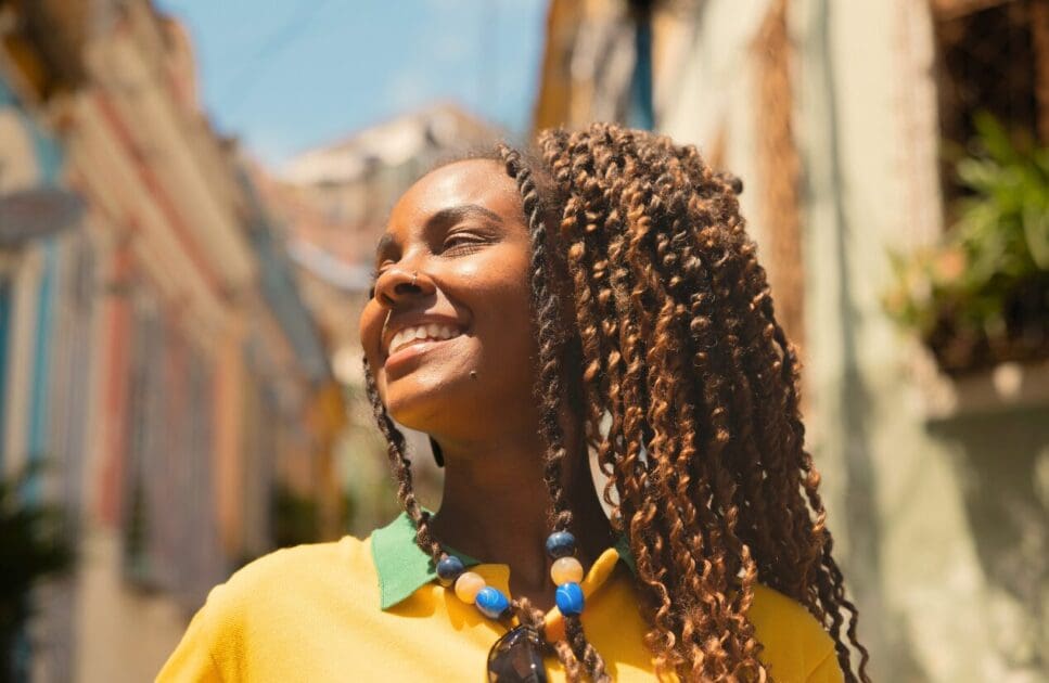 Woman smiling under the sun. Probiotics for Thrush. Quit Smoking Hypnotherapy. Brisbane Livewell Clinic