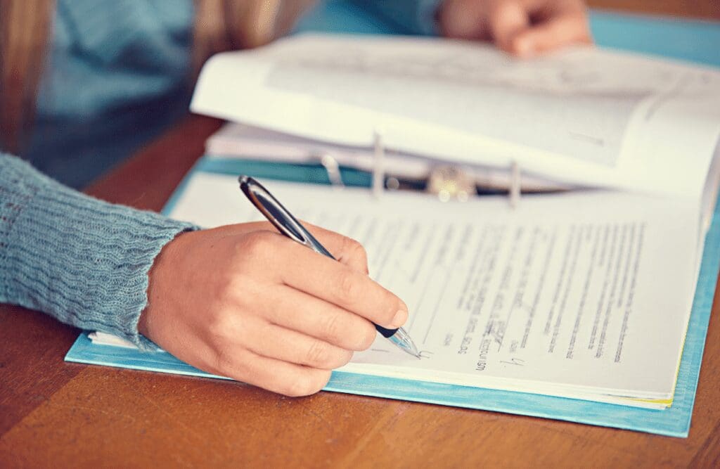 Naturopath writing down patient's assessment. Gut Health Brisbane. Brisbane Livewell Clinic
