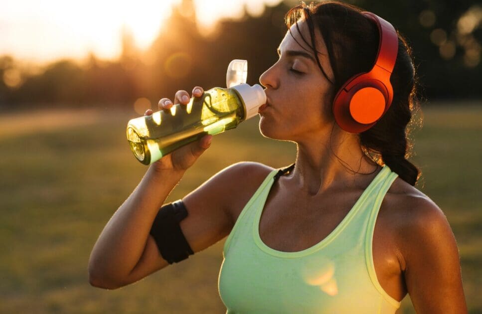 Woman drinking water after workout. IBS. Brisbane Livewell Clinic