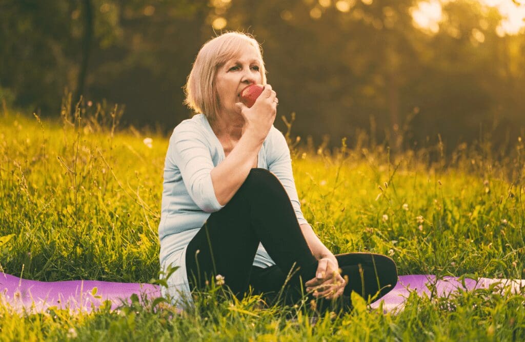 Woman around 60 eating apple. Fibre. Brisbane Livewell Clinic