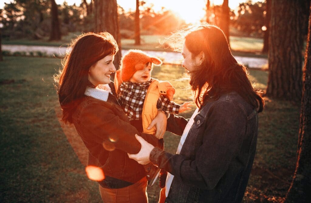 Happy family enjoying time outdoors at sunset. Naturopaths, Brisbane Livewell Clinic