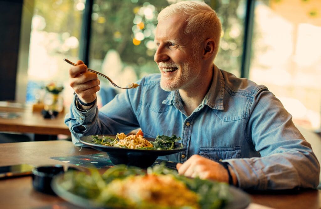 Man eating healthy meal in the restaurants. Overcoming Food Intolerance. Age. Exercise. Clinical Nutritionist Morningside. Nutrition Brisbane. Brisbane Livewell Clinic