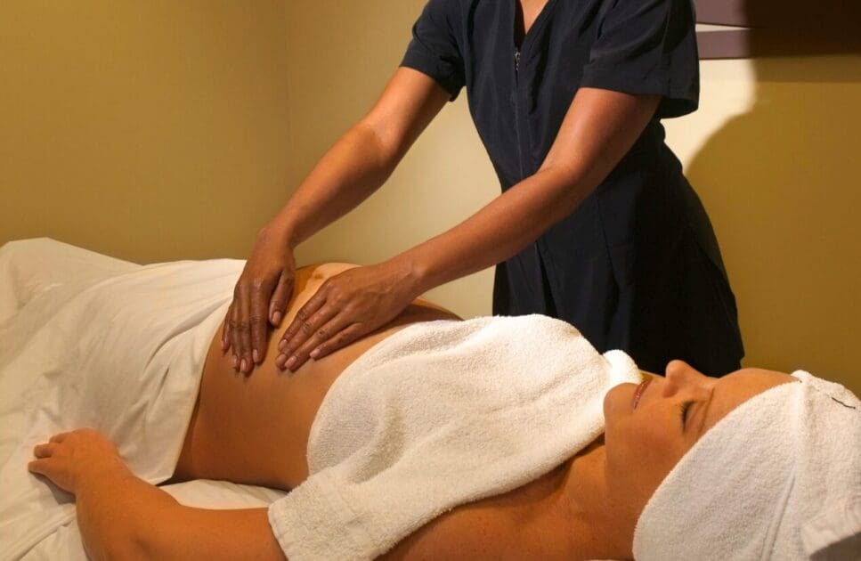 Pregnant woman receiving a massage. Pregnancy Massage Near Me. Brisbane Livewell Clinic