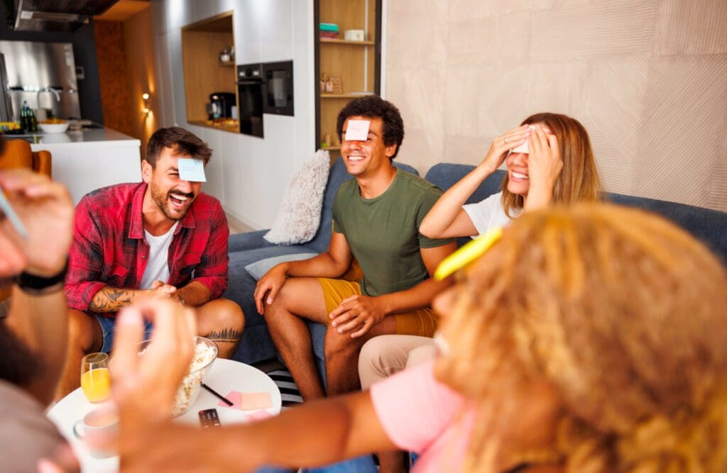 Friends having fun playing charades. Food Intolerance Testing. Brisbane Livewell Clinic. Naturopaths Brisbane