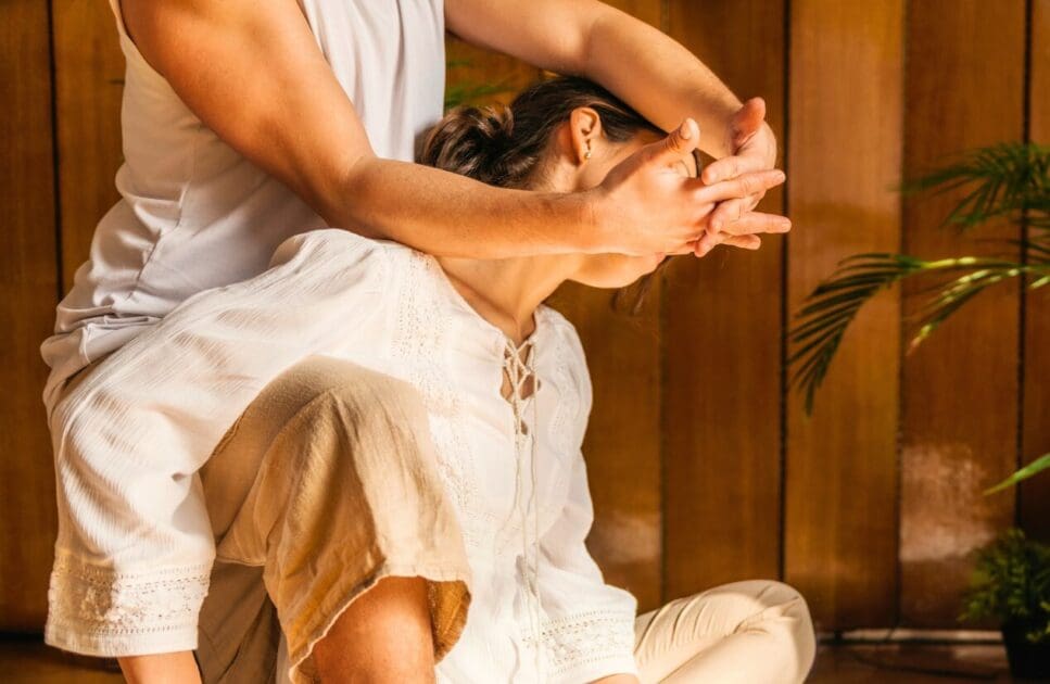 Woman receiving thai neck stretching massage. Thai Massage Near Me. Brisbane Livewell Clinic