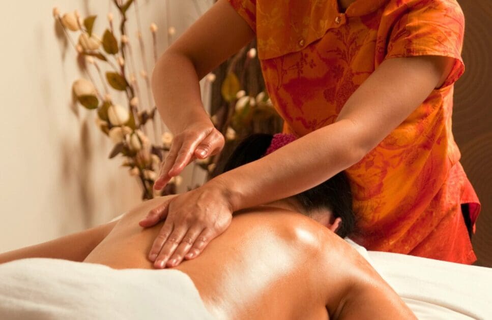 Masseur giving woman a thai back massage. Thai Massage Near Me. Massage Near Me. Brisbane Livewell Clinic