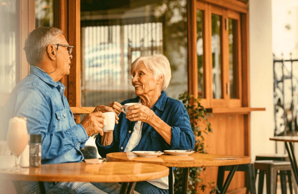 Couple around 60 talking over a cup of coffee. Gut brain connection. Age. What is Holistic Counselling. Brisbane Livewell Clinic