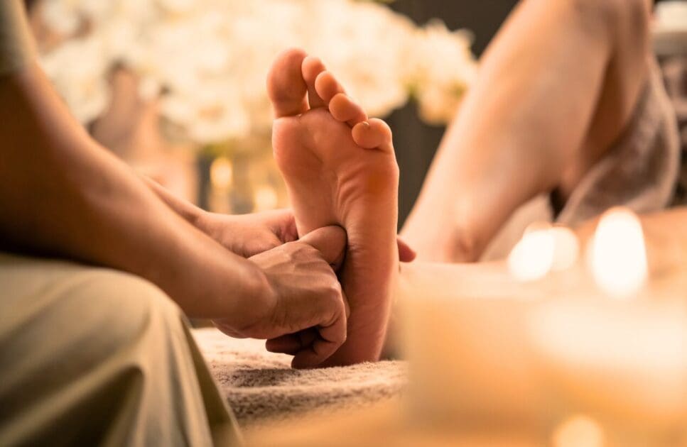 Woman having reflexology foot massage in wellness spa. Reflexology Near Me. Brisbane Livewell Clinic