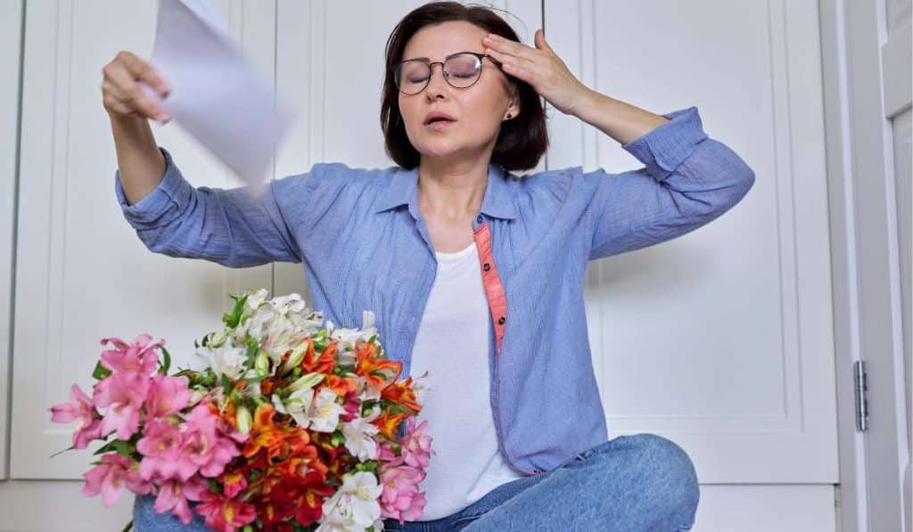 Woman experiencing hot flashes. Early Menopause. Brisbane Livewell Clinic