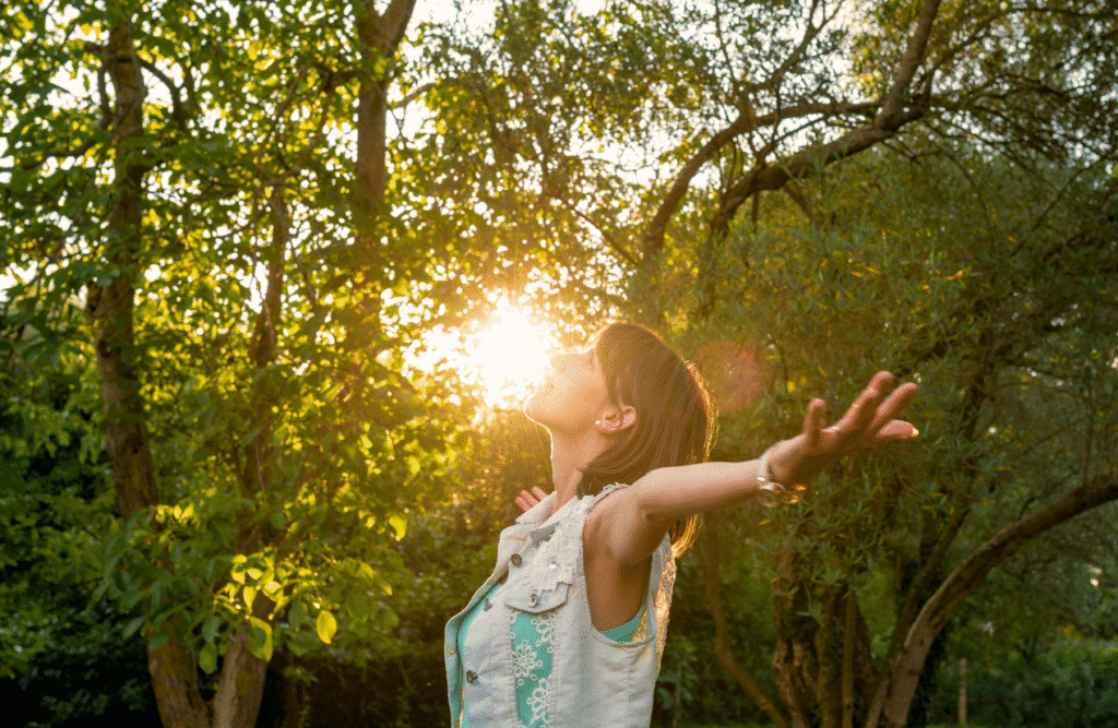 Woman with outstretched arms, breathing deeply. Natural Therapies Brisbane. Naturopath. Brisbane Livewell Clinic