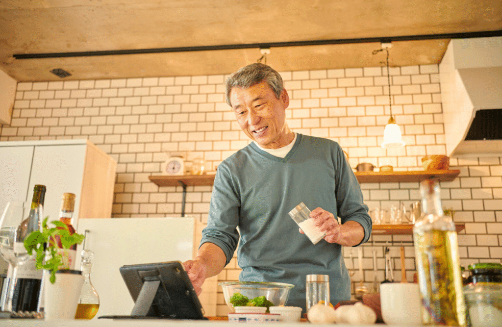 Man around 60's cooking in a modern kitchen. Men's Health Supplements. Food Allergy Testing. Clinical Nutritionist Camp Hill. Brisbane Livewell Clinic