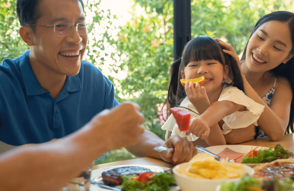 Happy family eating together. Clinical Nutritionist Murarrie. Brisbane Livewell Clinic