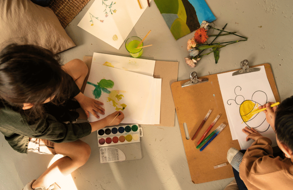 Two children engaged in creative art activities. ADHD Naturopath. Brisbane Livewell Clinic