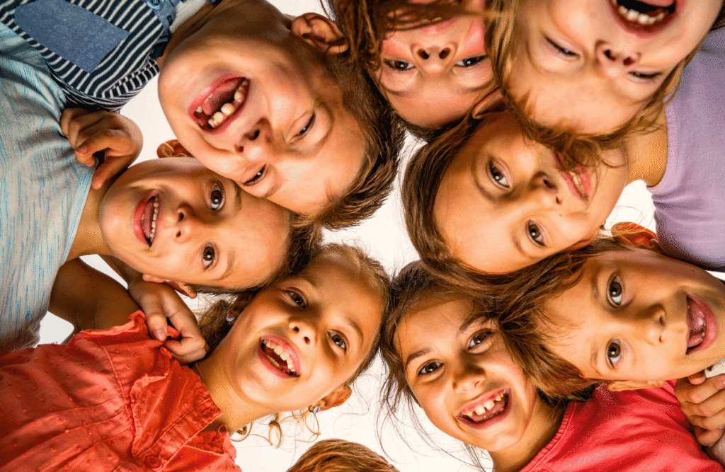 Group of children standing in a circle. ADHD Naturopath. How Can Physiotherapy Help. Brisbane Livewell Clinic. Bowen Therapist