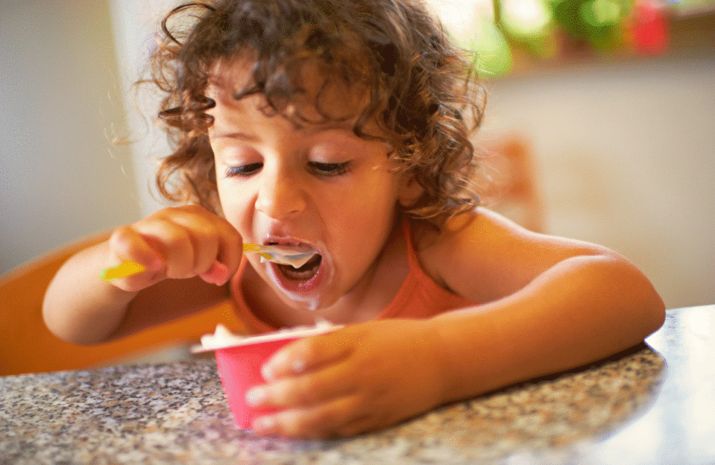 Girl eating yoghurt. Fermented Foods. Brisbane Livewell Clinic