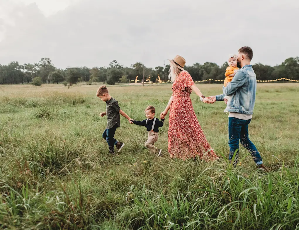 Family walking in a field. Brisbane Livewell Clinic your Health and Wellness Brisbane Centre
