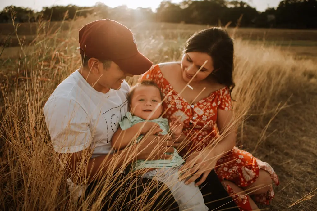 Young family sitting in the grass. Nathan Gurry, Holistic Counsellor in Brisbane