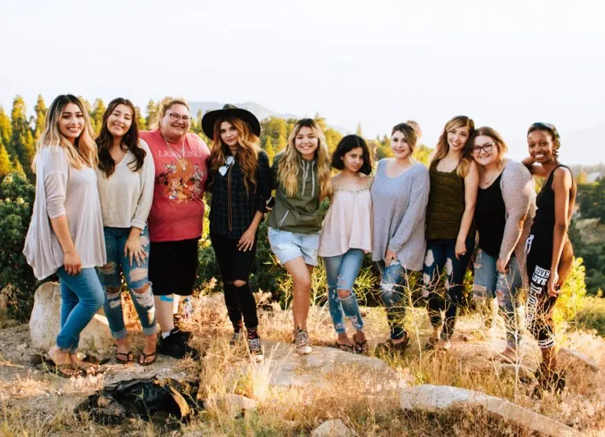 Friends standing on a rock. DNA Testing with Methylation. Testing Functional Medicine
