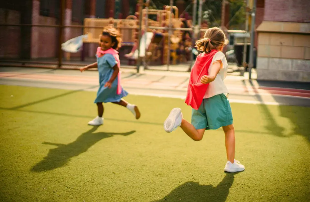 Happy girls running around in the outdoor playground. Counselling Virginia. Brisbane Livewell Clinic