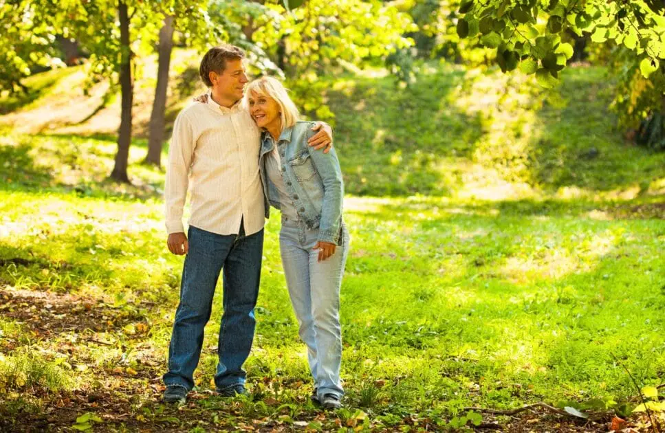 Middle-aged couple walking in the park. Counselling Near Me. Couples Therapy Counselling. Couples Counselling and Relationship Counselling. Counselling Chermside. Brisbane Livewell Clinic
