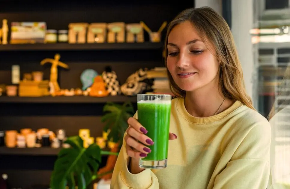 Woman holding a glass of detox juice. How to Detox. Spring Detox. Brisbane Livewell Clinic