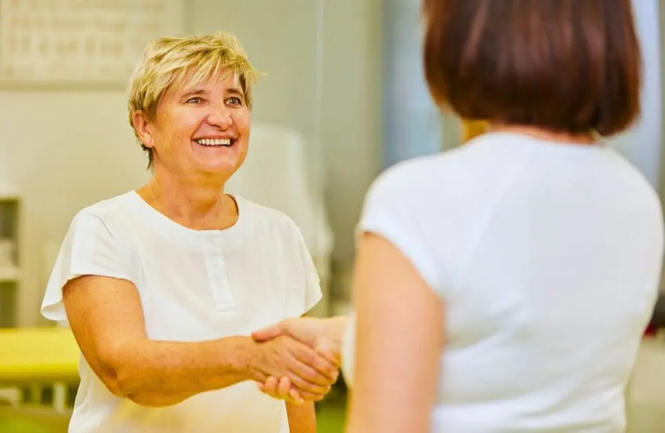 Woman handshake with the Practitioner. How to Detox. How often should you see an Osteopath. Brisbane Livewell Clinic