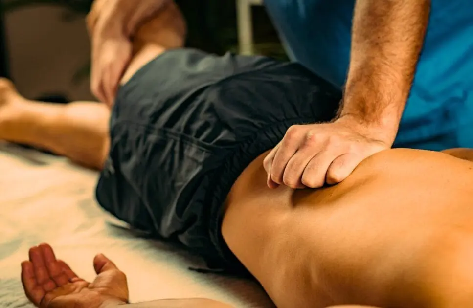Man receiving sports massage. Therapeutic Value of Massage Therapy. How to Choose a Massage Therapist. Brisbane Livewell Clinic