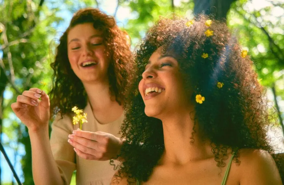 Two women smiling and laughing together. Treating Depression with Naturopathy. Holistic Counselling Nundah. Counselling Brisbane. Brisbane Livewell Clinic