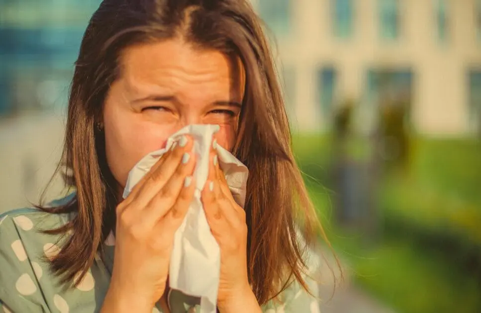 Woman experiencing runny nose. know about Food Intolerance. Brisbane Livewell Clinic