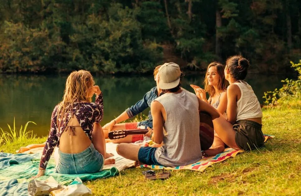 Young friends having picnic near the lake. Holistic Counselling for Adults Who Feel Too Much. I Don't Feel Like I Belong Anywhere. Counselling Stafford. Brisbane Livewell Clinic