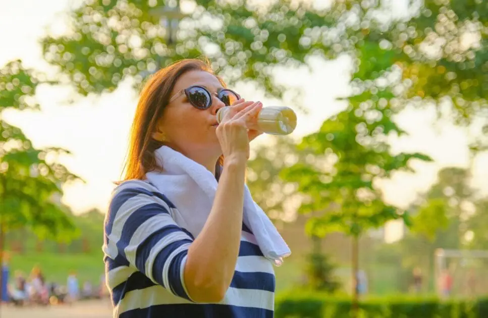 Middle-aged woman drinking a bottle of milk. Lifestyle Changes Women Need. Genetic Methylation Test. Iron Deficiency. Brisbane Livewell Clinic