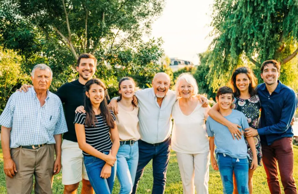 Happy extended family from Bulimba standing in the backyard. Naturopath Wavell Heights. Osteopath Bulimba. Osteopath. Brisbane Livewell Clinic