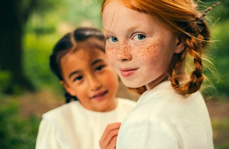 A close-up shot of two girls smiling. Iron Deficiency. Brisbane Livewell Clinic
