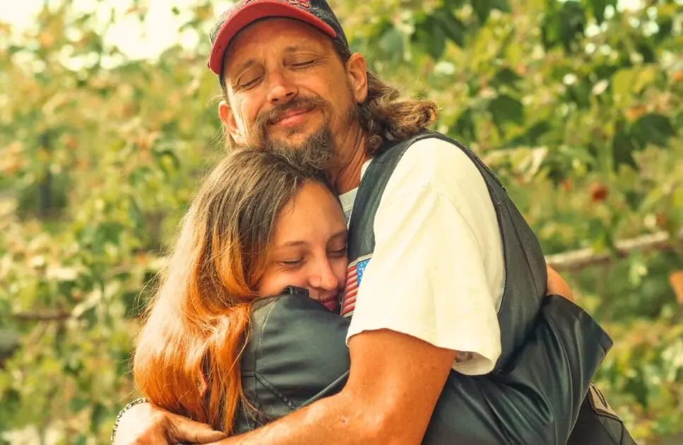 Father and daughter hugging each other. Counselling the Bereaved. Naturopath Toowoomba. Holistic Counselling for Sensitive Adults. Brisbane Livewell Clinic