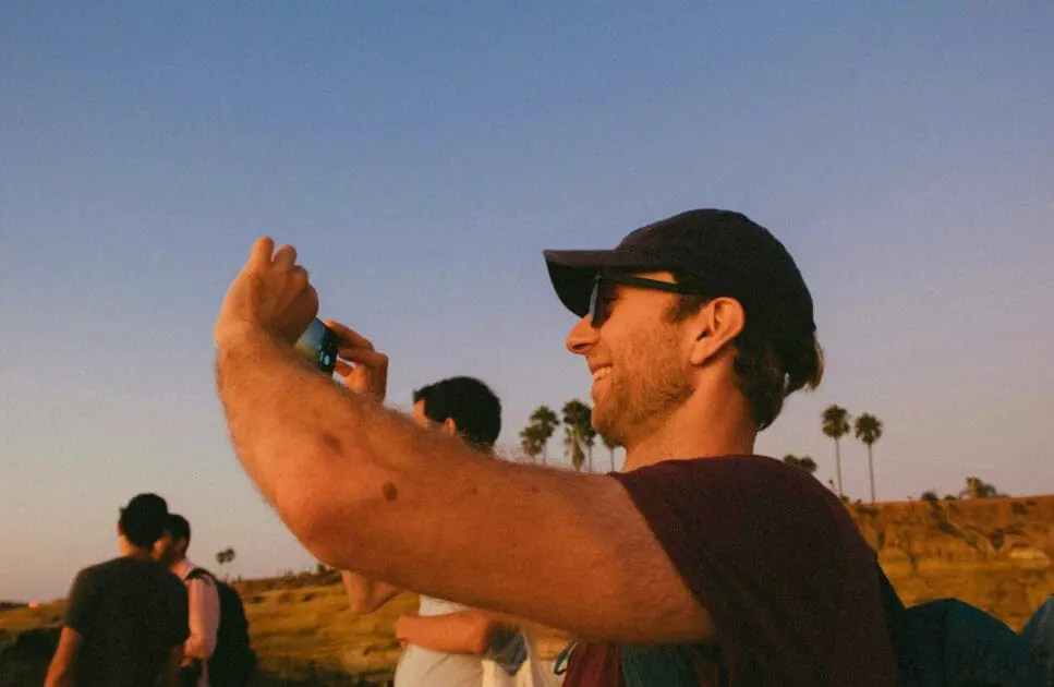 Man smiling while taking photos. Counselling Camp Hill. Brisbane Livewell Clinic. Methylation Test Near Me
