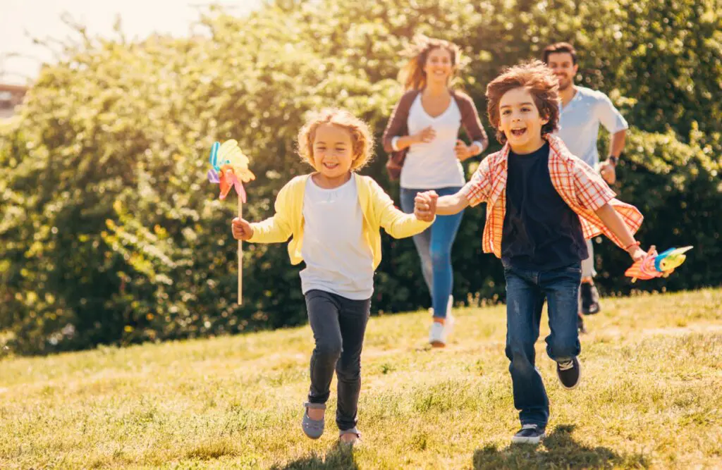 Kids playing with their parents in the park. Can Bowen Therapy Help Sciatica. How long to detox heavy metals from body. Brisbane Livewell Clinic