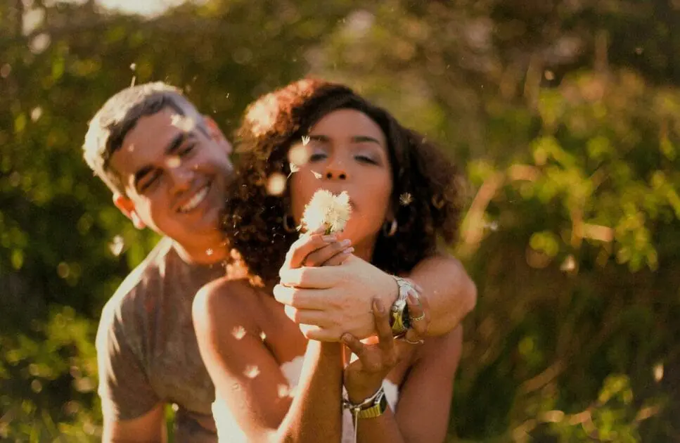 Woman blowing a dandelion flower seeds. DNA Health Testing. Clinical Nutritionist Cannon Hill. Brisbane Livewell Clinic