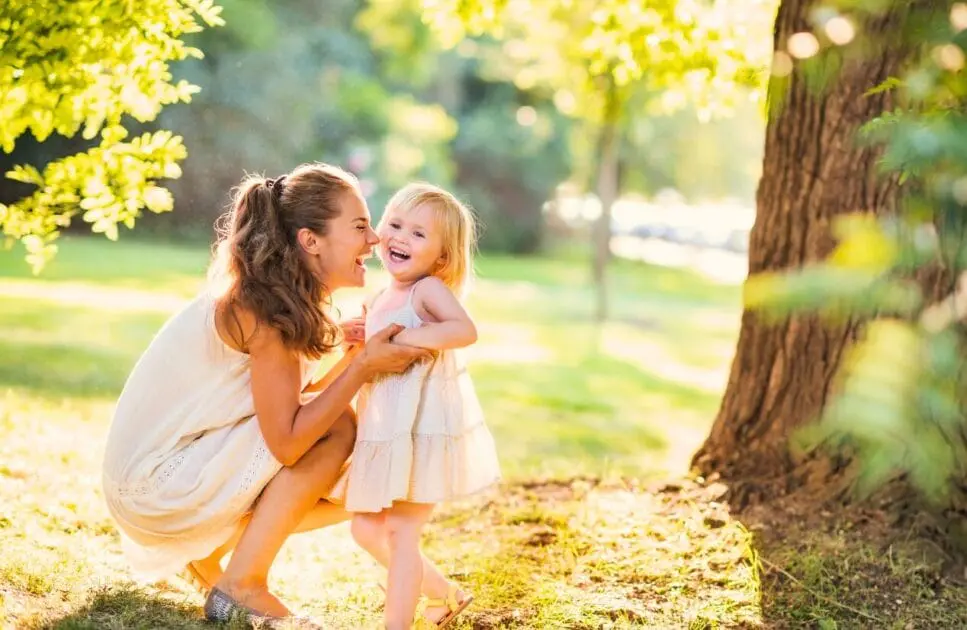 Woman and her daughter playing together in a sunny park. Hypnotherapy near Clayfield. Holistic Counselling North Brisbane. Brisbane Livewell Clinic