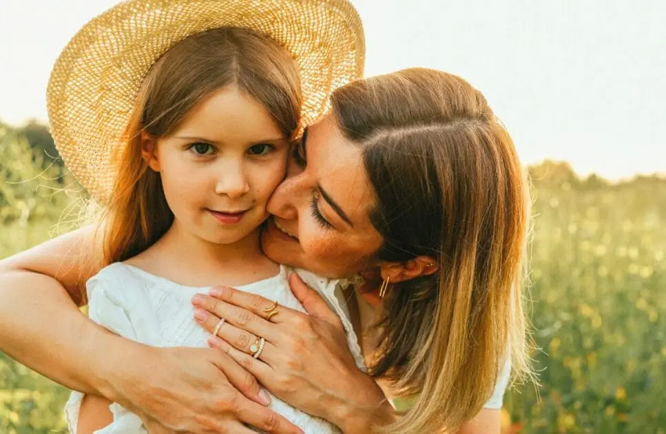 Mother hugging her daughter in a sunny field. Counselling Hemmant. Testing Functional Medicine. Brisbane Livewell Clinic